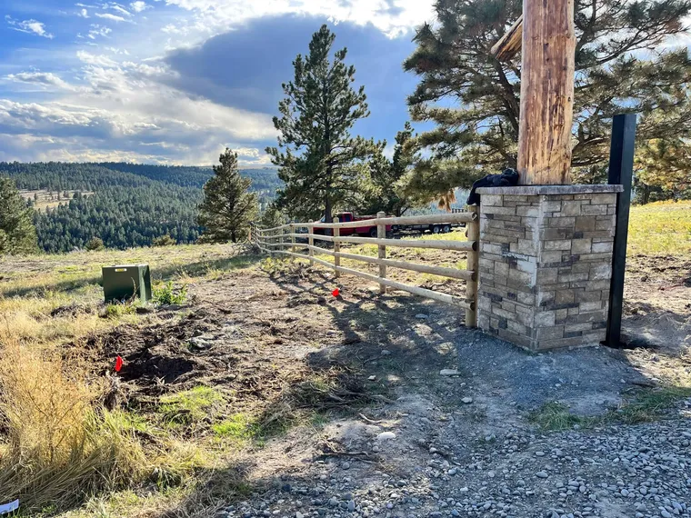 New four-rail split rail fence installed by Montana Ranch & Land Improvement Service