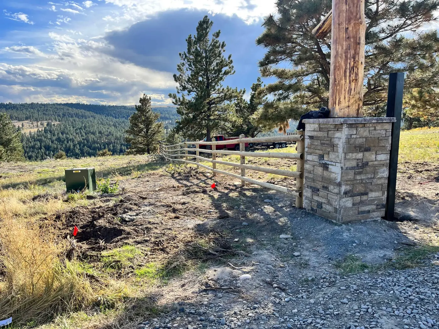 Four-rail split rail fence line on a Montana property