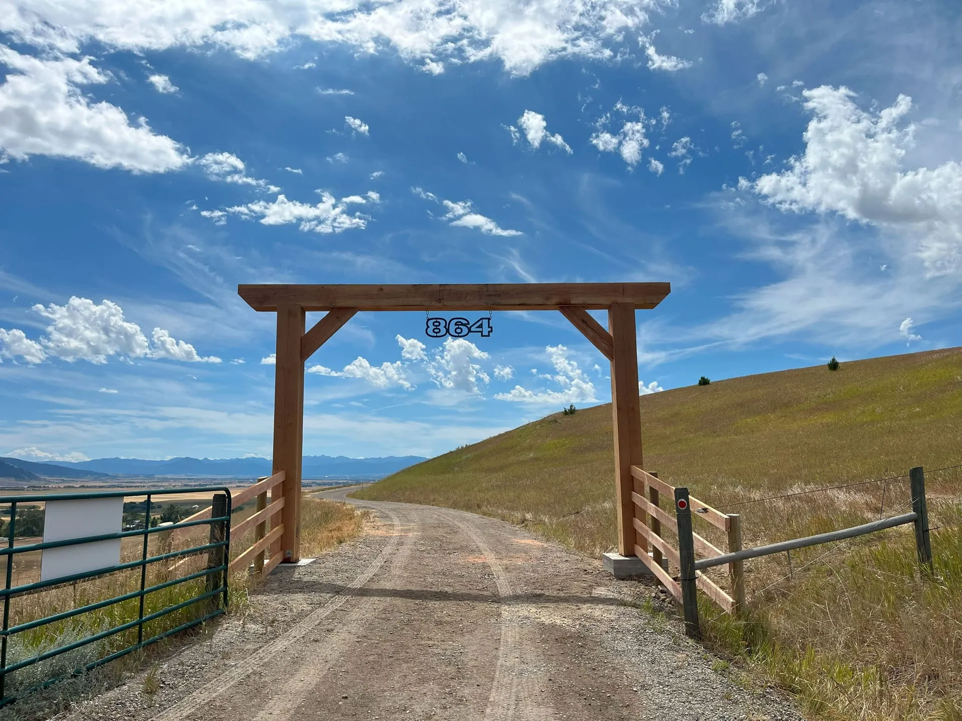 CNC-cut ranch entryway sign on a timber entrance