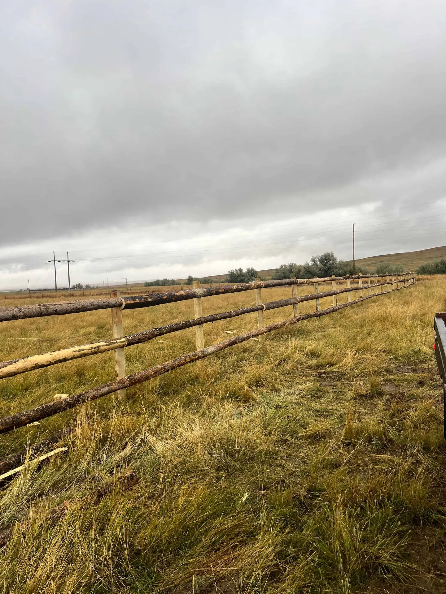 Rustic bark-on split rail fence in Montana
