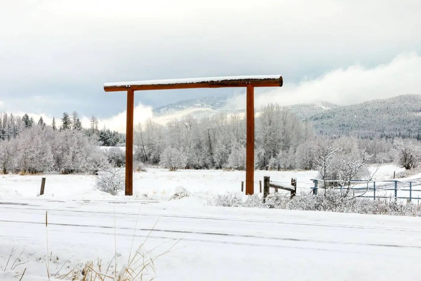 Custom ranch brand sign mounted on a Montana entrance