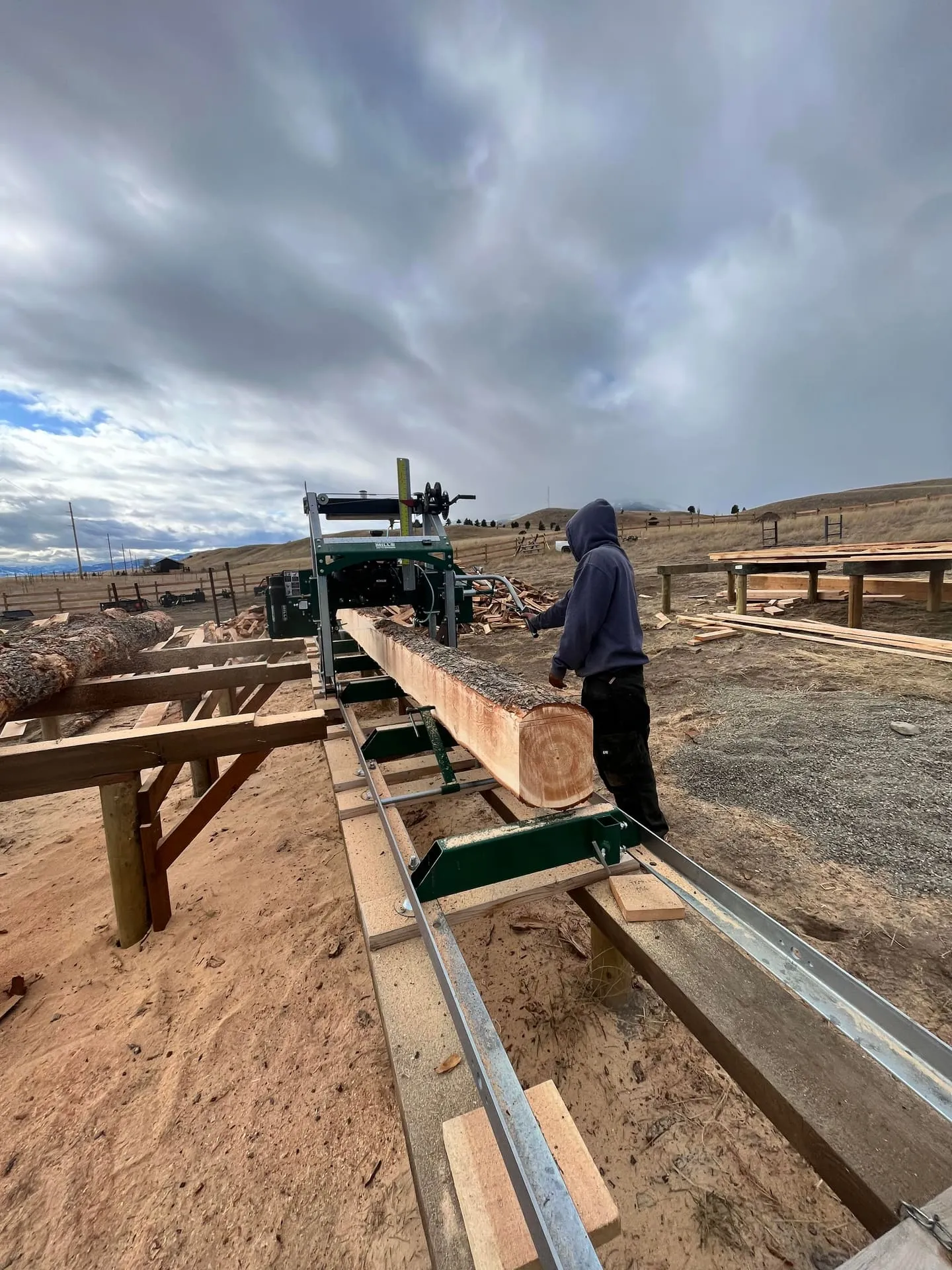 Fresh-milled dimensional lumber stacked at the sawmill