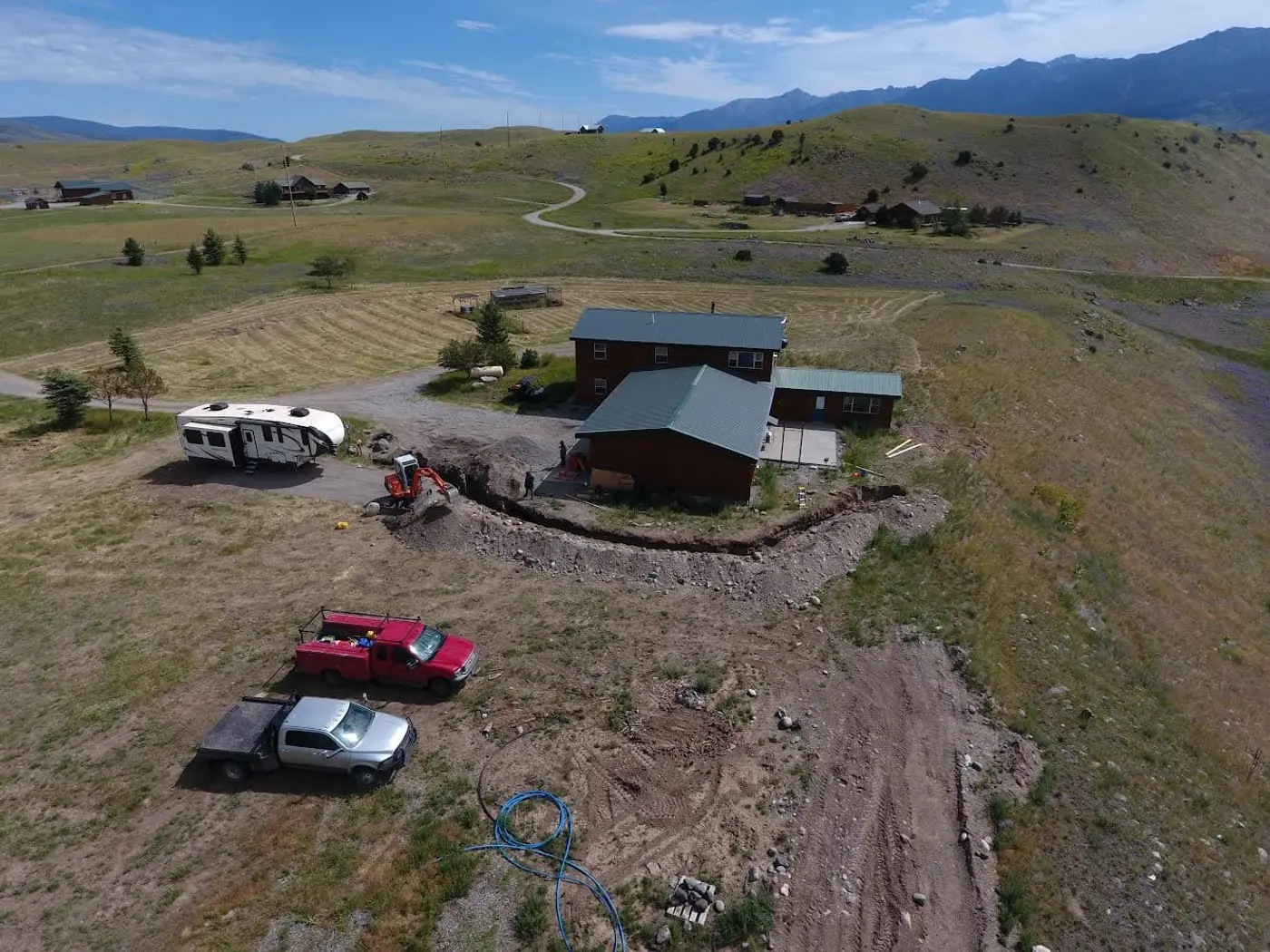 Excavation and utility trenching work on a Montana property