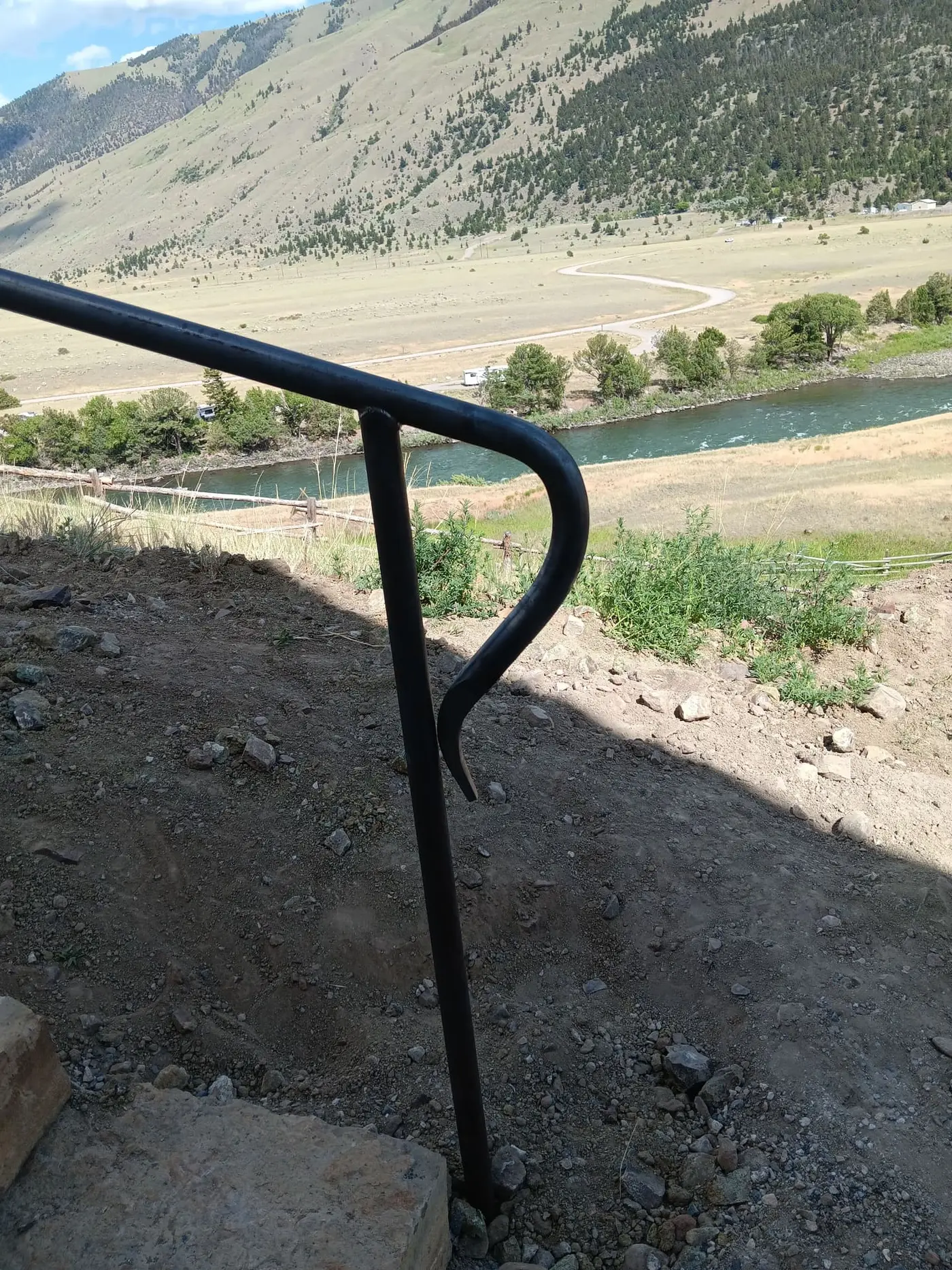 Steel railing along the flagstone staircase
