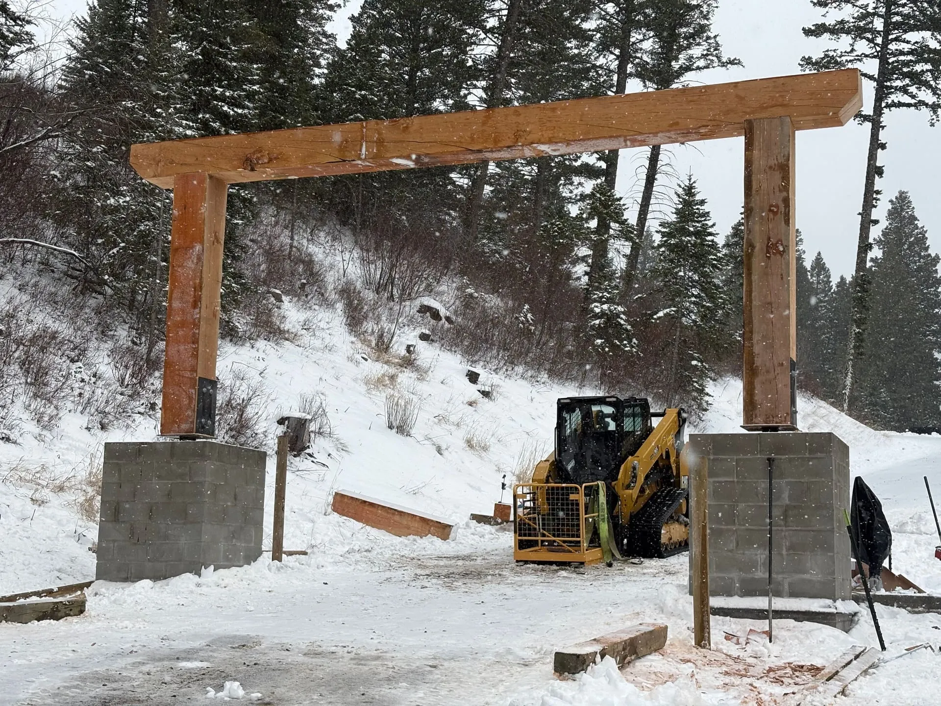 Ranch entrance with gate, archway and fencing working together